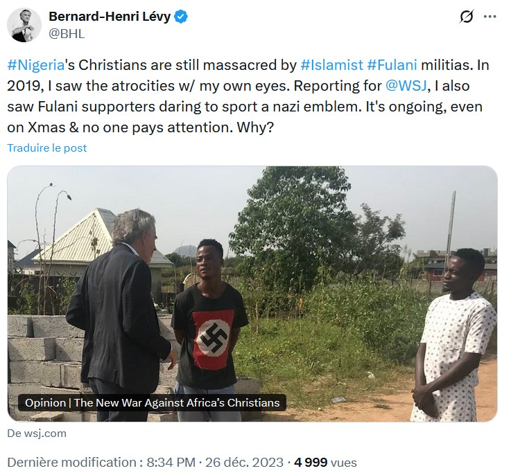 Tweet du compte attribué à Bernard-Henri Lévy dans lequel apparaît la photo de l'écrivain français avec un jeune Peul musulman du Nigeria vêtu d'un tee-shirt avec une croix gammée, également utilisée pour son article dans {Paris Match} en 2019.