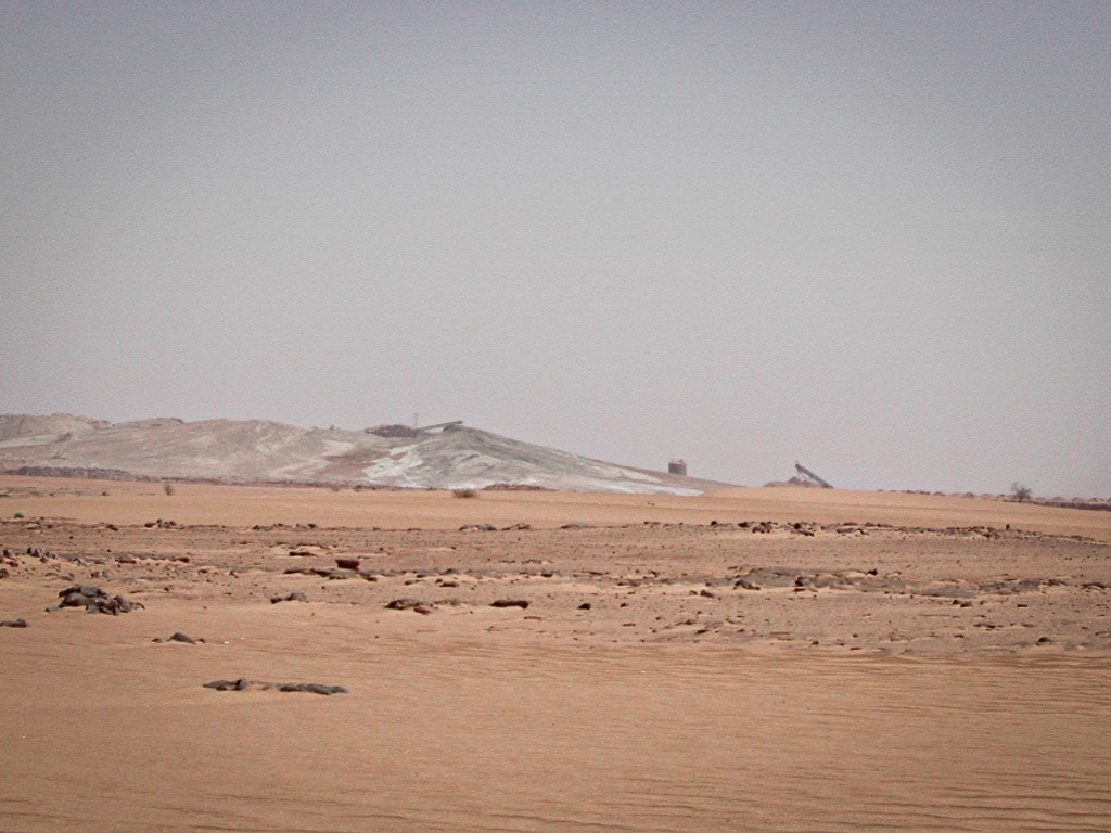 Huge piles of radioactive sludge from the leaching process are piled up in the open air inside the Somaïr mine.