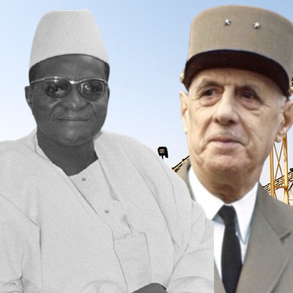 L'image montre deux figures importantes de l'histoire. À gauche, on voit un homme portant une tenue traditionnelle, avec une chemise blanche et un chapeau. Il a une expression sereine. À droite, un homme en uniforme militaire, avec un chapeau distinctif, regardant vers l'objectif. L'arrière-plan est composé d'une infrastructure industrielle, peut-être des machines ou des bâtiments, qui évoque un cadre de développement économique. L'ensemble de l'image semble évoquer une rencontre entre deux cultures ou époques différentes.