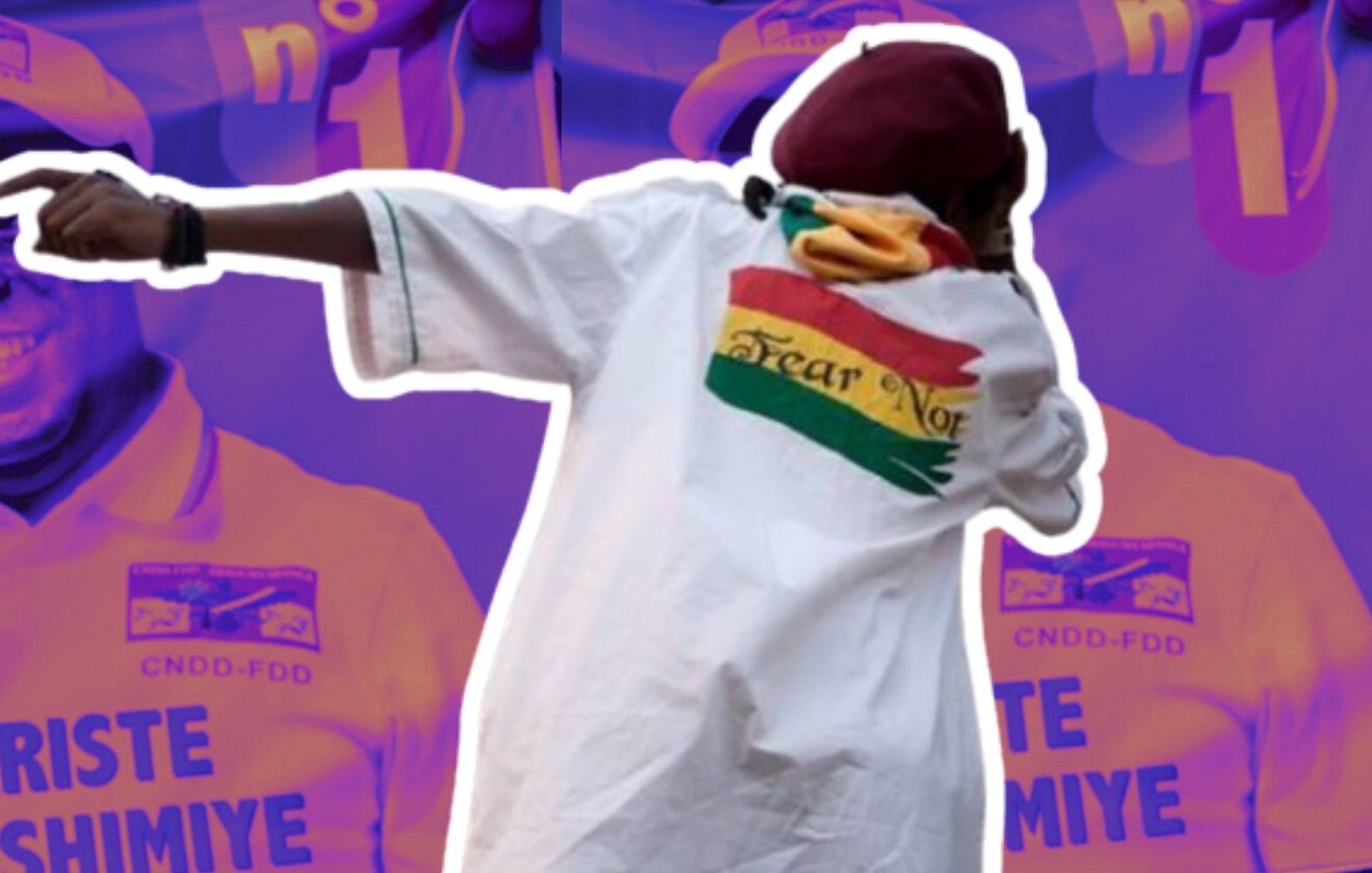 The image features a figure wearing a white shirt with vibrant colors and a design on the back. The background includes repeated images of a man, possibly a political figure, smiling and wearing a hat with a logo. The overall color scheme is purple, enhancing a dynamic atmosphere. The shirt's imagery suggests a message of confidence or defiance.