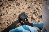 Almoustapha Alhacen's scintillometer measures radiation levels 10 to 20 times higher than normal in the soil of the former SNTN transport company depot in the centre of Arlit.